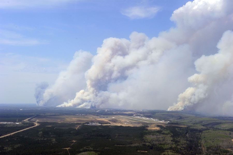 Raging wildfire spreads to more areas in west Canada