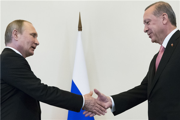 Putin and Erdogan meet in bid to 'restart dialogue'