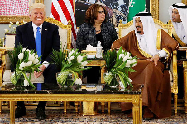 Under fire at home, Trump launches first foreign trip in Saudi